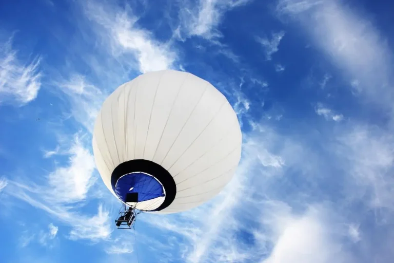 White Hot Air Balloon in Blue Skies